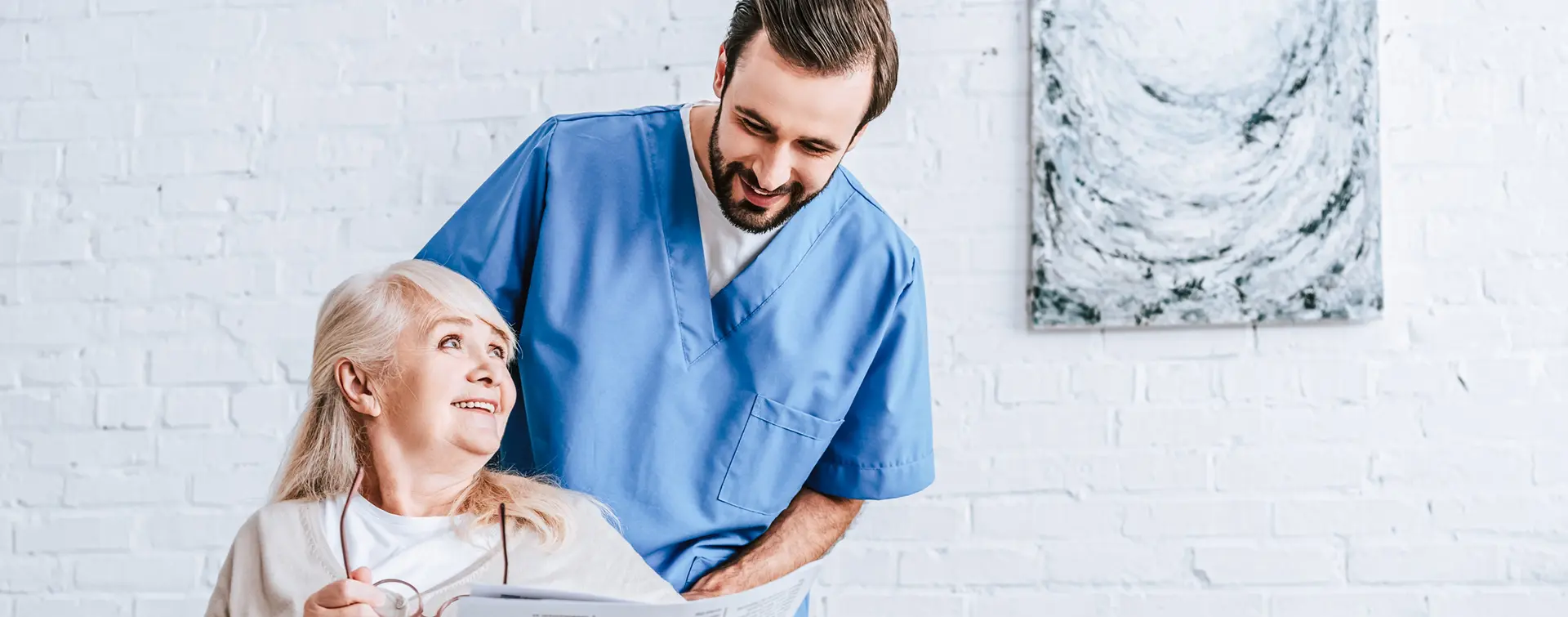 Caregiver stands behind a stroke patient